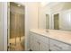 Bathroom featuring white cabinets, a glass shower, and a vanity with mirror at 7542 Waverly Walk Ave # 7542, Charlotte, NC 28277