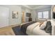 Bright bedroom featuring a window bench, TV, neutral decor, and an ensuite bathroom for a comfortable retreat at 7542 Waverly Walk Ave # 7542, Charlotte, NC 28277