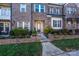 Inviting brick townhome featuring a well-manicured yard and welcoming entrance at 7542 Waverly Walk Ave # 7542, Charlotte, NC 28277