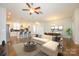Open-concept living space featuring a modern kitchen, dining area, and a cozy seating arrangement at 7542 Waverly Walk Ave # 7542, Charlotte, NC 28277
