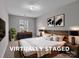 This virtually staged bedroom features a rustic wood bedframe and stylish decor at 8702 Wood Sorrel Ct, Matthews, NC 28105