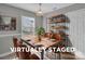Dining room with wood table and shelving at 8702 Wood Sorrel Ct, Matthews, NC 28105