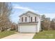 Charming two-story home features a two-car garage and welcoming curb appeal at 8702 Wood Sorrel Ct, Matthews, NC 28105