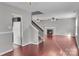 The living room is open to the staircase and fireplace, perfect for gatherings at 8702 Wood Sorrel Ct, Matthews, NC 28105