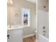 Clean bathroom with single vanity, bathtub, and shower at 9181 Cherokee Dr, Hickory, NC 28601