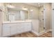 Elegant bathroom with double vanity, large shower, and modern fixtures at 9181 Cherokee Dr, Hickory, NC 28601