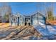 Newly built home featuring gray siding, a two-car garage, and a well-maintained lawn at 9181 Cherokee Dr, Hickory, NC 28601