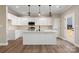 Modern kitchen featuring white cabinets, quartz countertops, and an island at 9181 Cherokee Dr, Hickory, NC 28601