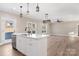 Modern kitchen with white cabinetry, center island, and stainless steel appliances at 9181 Cherokee Dr, Hickory, NC 28601