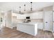 Bright kitchen with white cabinets, an island, and stainless steel appliances at 9181 Cherokee Dr, Hickory, NC 28601