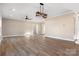 Open living area with hardwood floors and multiple windows at 9181 Cherokee Dr, Hickory, NC 28601