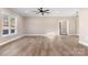 Large living room with hardwood floors and ceiling fan at 9181 Cherokee Dr, Hickory, NC 28601