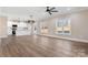 Spacious living room with kitchen, island, and hardwood floors at 9181 Cherokee Dr, Hickory, NC 28601