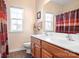 Bathroom with double sinks and patterned shower curtain at 9729 Capella Nw Ave, Concord, NC 28027