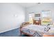Bedroom with wood bed frame and blue carpet at 9729 Capella Nw Ave, Concord, NC 28027