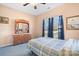 Bedroom with wood dresser and blue bedding at 9729 Capella Nw Ave, Concord, NC 28027