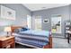 Bright bedroom with wood bed frame and ample natural light at 9729 Capella Nw Ave, Concord, NC 28027
