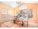 Bright dining room with hardwood floors and a large arched window at 9729 Capella Nw Ave, Concord, NC 28027