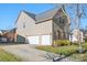 Two-car garage with driveway and landscaping at 9729 Capella Nw Ave, Concord, NC 28027