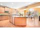 Eat-in kitchen with island, hardwood floors, and sunlit breakfast area at 9729 Capella Nw Ave, Concord, NC 28027
