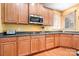 Kitchen with granite countertops and stainless steel appliances at 9729 Capella Nw Ave, Concord, NC 28027