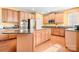 Spacious kitchen with an island, stainless steel appliances, and hardwood floors at 9729 Capella Nw Ave, Concord, NC 28027
