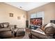 Relaxing sitting room with leather chairs and large TV at 9729 Capella Nw Ave, Concord, NC 28027