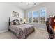 Bright bedroom with double bed and window seat at 1025 Lake Como Dr, Monroe, NC 28110