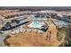 Aerial view of community pool, tennis courts, and clubhouse at 1025 Lake Como Dr, Monroe, NC 28110