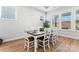 Bright dining room with a farmhouse table and access to backyard at 1025 Lake Como Dr, Monroe, NC 28110