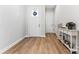 Bright and airy entryway with hardwood floors and a console table at 1025 Lake Como Dr, Monroe, NC 28110