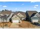 Two-story home with attached garage and landscaping at 1025 Lake Como Dr, Monroe, NC 28110