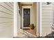 Inviting front entry with dark door and wreath at 1025 Lake Como Dr, Monroe, NC 28110