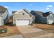 Side view of house exterior with two car garage at 1025 Lake Como Dr, Monroe, NC 28110