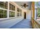 Spacious covered back porch with ceiling fan and access to the home's interior at 1037 Oakmont Dr, Rock Hill, SC 29732