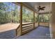 Covered back porch with wooden railing overlooks the spacious backyard at 1037 Oakmont Dr, Rock Hill, SC 29732