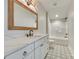 Bright bathroom features a white vanity with marble countertop and patterned tile flooring at 1037 Oakmont Dr, Rock Hill, SC 29732