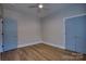 Cozy bedroom with wood-look flooring, ample natural light, and blue painted doors at 1037 Oakmont Dr, Rock Hill, SC 29732