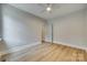 Minimal bedroom featuring hardwood flooring, neutral color palette and a ceiling fan at 1037 Oakmont Dr, Rock Hill, SC 29732