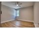 Bedroom with wood-look flooring, a large window, and neutral paint at 1037 Oakmont Dr, Rock Hill, SC 29732