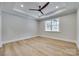 Spacious bedroom with ceiling fan, tray ceiling, and large window for natural light at 1037 Oakmont Dr, Rock Hill, SC 29732