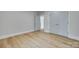 Neutral bedroom with wood flooring, a closet, and an open door leading to the hallway at 1037 Oakmont Dr, Rock Hill, SC 29732