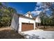 A beautiful home boasting white siding, a brown garage door, and a welcoming front porch at 1037 Oakmont Dr, Rock Hill, SC 29732