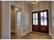 A view of a foyer featuring wood-look flooring and a striking double-door entrance at 1037 Oakmont Dr, Rock Hill, SC 29732