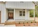 Inviting front porch with brick base, white columns, and a view of the stained front door at 1037 Oakmont Dr, Rock Hill, SC 29732