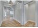 Bright hallway featuring coffered ceilings, white trim, and luxury vinyl plank flooring at 1037 Oakmont Dr, Rock Hill, SC 29732