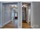 Inviting foyer and hallway featuring wood floors and decorative lighting fixtures at 1037 Oakmont Dr, Rock Hill, SC 29732