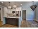 Bright kitchen with pendant lighting, stainless steel appliances, and a waterfall countertop island at 1037 Oakmont Dr, Rock Hill, SC 29732