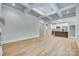 Open-concept living room with hardwood floors leading to a modern kitchen with stainless steel appliances at 1037 Oakmont Dr, Rock Hill, SC 29732