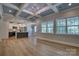 Open-concept living space with coffered ceilings, flowing into a stylish kitchen at 1037 Oakmont Dr, Rock Hill, SC 29732